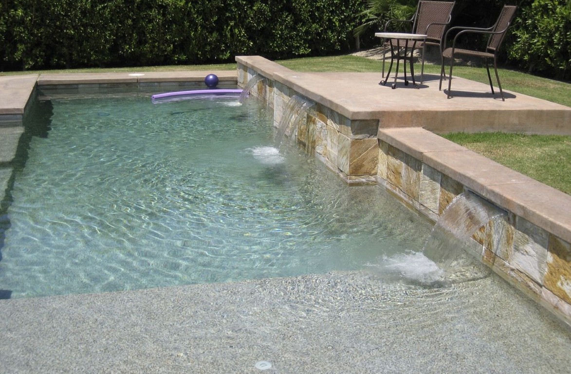Clean pool with beautiful waterfall feature after tile cleaning in Norwalk, CA